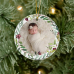 Décoration En Céramique Première Christmas Green Holiday Wreath Baby Photo<br><div class="desc">This elegant two-sided holiday photo keepsake ornament feobjets a newborn photo of your baby girl framed by a floral watercolor holiday greenery wreath. The back of the ornament includes "First Christmas" wording with custom text that can be personalized with the baby's full name and the year of their birth. Includes...</div>