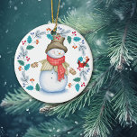 Décoration En Céramique Snowman mignon avec ornithologie Noël<br><div class="desc">L'avant de ce joli ornement de vacances a un bonhomme de neige heureux tout habillé dans son chapeau haut, foulard d'hiver, veste et mitaines. Avec un grand sourire sur le visage, il regarde un petit oiseau cardinal rouge qui est perché dans une feuille bleue et une couronne de baies rouges....</div>