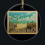 Décoration En Céramique Vintage voyage de Clearwater Beach<br><div class="desc">Ce design de carte postale vintage de Greutings From Clearwater Beach dispose d'une plage de sable avec une belle eau turquoise de l'océan et au-dessus de la mer,  un ciel bleu avec des nuages blancs lustrés. Dans un style de voyage vintage.</div>