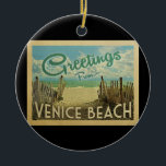Décoration En Céramique Vintage voyage de Venice Beach<br><div class="desc">Ce design de carte postale vintage de Salutations From Venice Beach dispose d'une plage de sable avec une belle eau turquoise de l'océan et au-dessus de la mer,  un ciel bleu avec des nuages blancs lustrés. Dans un style de voyage vintage.</div>