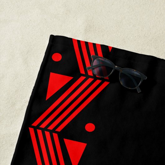 Decorgrens in rood en zwart strandlaken (In situ)