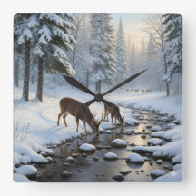 Deer drinking from a snow covered brook -