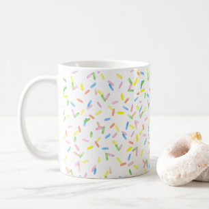 Des bonbons arrosent une mignonne mug d'aquarelle