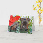 Des loutres. Une carte anniversaire pour les amate (Fleur jaune)