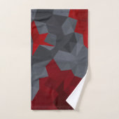 Des triangles gris, rouges disposés aléatoirement. (Serviette à main)