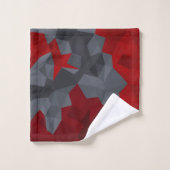 Des triangles gris, rouges disposés aléatoirement. (Gant de toilette)
