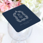 Dessous-de-verre Carré En Papier Noms vintages de la crête de monogramme Marine Mar<br><div class="desc">Ce design élégant présente une crête ornée, d'inspiration vintage, d'acanthus feuilles encadrant deux initiales monogrammes en police serif ouverte, empilée verticalement et séparée par une fine ligne horizontale. Ajoutez les noms du couple et la date du mariage ci-dessous. Le design et le texte sont en blanc sur un arrière -...</div>