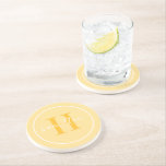 Dessous De Verre En Grès Élégant jaune doré sur mesure Monogramme initial<br><div class="desc">Élégant design de dessous de verre de boisson personnalisée ronde avec un classique monogramme de serif personnalisé dans une couleur jaune marigé doré ensoleillé avec votre nom de famille dans script de calligraphie blanc moderne contre un arrière - plan jaune clair. Un simple cercle blanc encadre le design. Le jeu...</div>