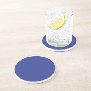 Dessous De Verre En Grès un avion volant dans le ciel avec un fond bleu