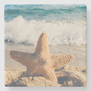 Dessous-de-verre En Pierre Starfish sur une plage de sable Photo