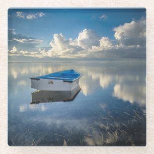 Dessous-de-verre En Verre Bateau de rangée sur l'eau