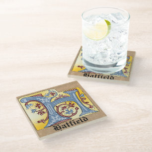 DESSOUS-DE-VERRE EN VERRE LETTRE BLEUE MOYENNE ET ROUGE LIVRE ÉCLAIRÉ H