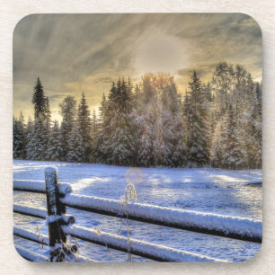 Dessous-de-verre Lever de soleil sur un pâturage d'hiver en neige