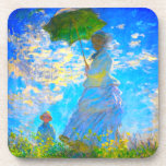 Dessous-de-verre Monet Woman avec un parasol<br><div class="desc">Un ensemble de portraits de famille avec la femme de Claude Monet,  Camille,  tenant un parasol,  et leur fils,  Jean,  se promène dans un champ vert vif soufflé par le vent pendant une journée d’été. Un grand cadeau Monet pour les amateurs d'impressionnisme et d'art français.</div>