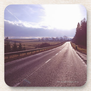 Dessous-de-verre Route principale avec le bas hiver sun.