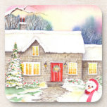 Dessous-de-verre Snowy Cottage Watercolor Painting<br><div class="desc">Based on my watercolor painting, Snowy Cottage, a painting of a beautiful winter picture of an an English thatched rottage covered in snow, with a decorated conifer at the front of the house and a cute snowman greeting at the foreground. The cottage ce que fully lit inside, glowing with the...</div>