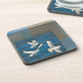 Dessous-de-verre Trois mouettes blanches volent au-dessus de l'eau (Côté gauche)