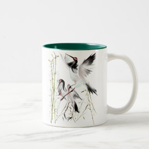 Deux grues dans des tasses en bambou