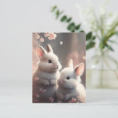 Deux lapins mignons avec carte postale de fleurs d (Debout devant)