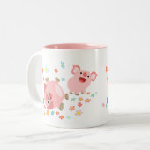Deux mignons cochons de caricature dans la tasse d (Devant gauche)