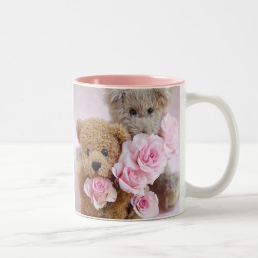 deux nounours tenant de la tasse à café rose (Droit)