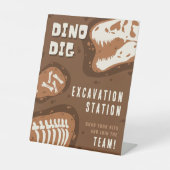 Dino Dig Dinosaurus opgravingsstation Party Reclamebord Met Voetstuk (Voorkant)