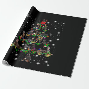 Doberman kerstboom bedekt door vlieglicht cadeaupapier