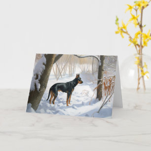 Doberman Pinscher liet het sneeuwen Kerstmis Kaart