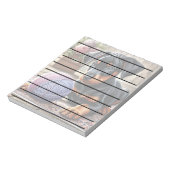 Doberman puppy met garenbal op een kleurrijk tapij notitieblok (Gedraaid)