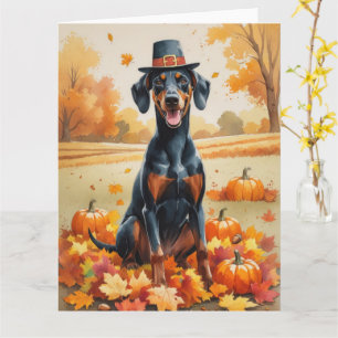 Dobermann in herfstbladeren dankdag kunst kaart