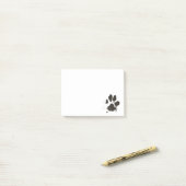 Dog paw schrijft dat hij merkt, schattig huisdier post-it® notes (Op bureau)