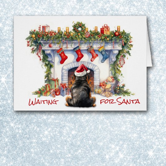 Dog Rottweiler attend Père Noël Cheminée de Noël