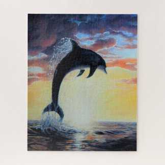 Dolfijnen springen uit zee bij zonsondergang/zonso legpuzzel