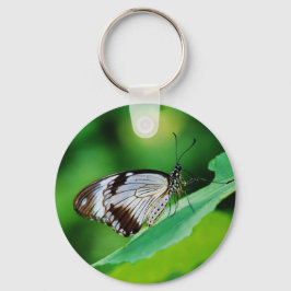 Donkerbruin en grijze vlinder sleutelhanger