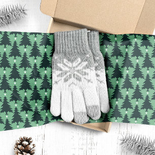 Donkergroene kerstbomen op groen tissuepapier