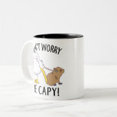 Don't Worry, Be Capy. Capybara Orange Unbothered Tweekleurige Koffiemok (Voorkant links)