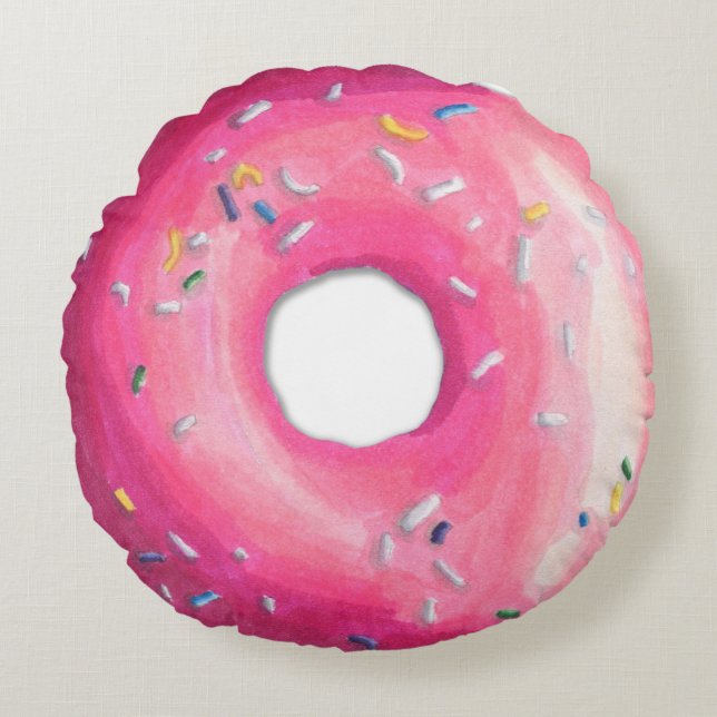 Donut rose avec des arroses autour de coussin (Devant)