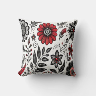 Doodle bloemen en bladeren in rood en zwart kussen
