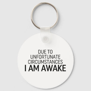 Door ongelukkige omstandigheden ben ik wakker sleutelhanger