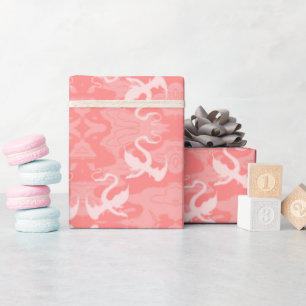 Draken boven roze cadeaupapier
