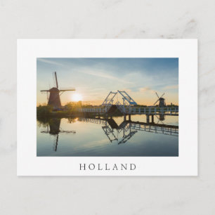 Drawbridge en windmolens bij zonsondergang in Nede Briefkaart