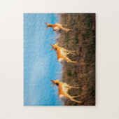 Drie antilopen lopen weg bij zonsondergang legpuzzel (Verticaal)