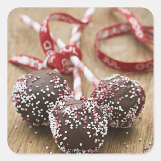 Drie chocoladelollipops vierkante sticker (Voorkant)