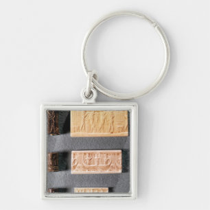 Drie cilinderzegels met indrukking sleutelhanger