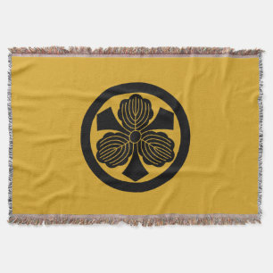 Drie eikenbladeren met een cirkel deken