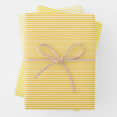 Drie gele stripes met schaduwen die papierbladen v inpakpapier vel (In situ)