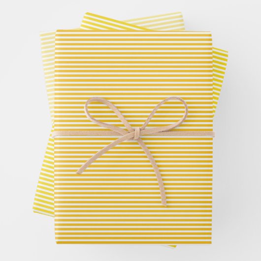 Drie gele stripes met schaduwen die papierbladen v inpakpapier vel (In situ)