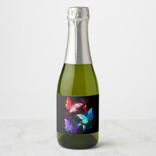 Drie gloeiende vlinders op nachtelijke achtergrond sparkling wijnetiket
