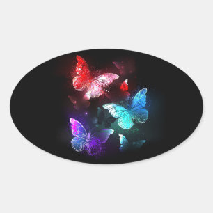 Drie golvende Butterflies op nachtachtergrond Ovale Sticker