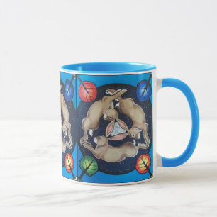 Drie konijnen hagen op zonenblauw mok